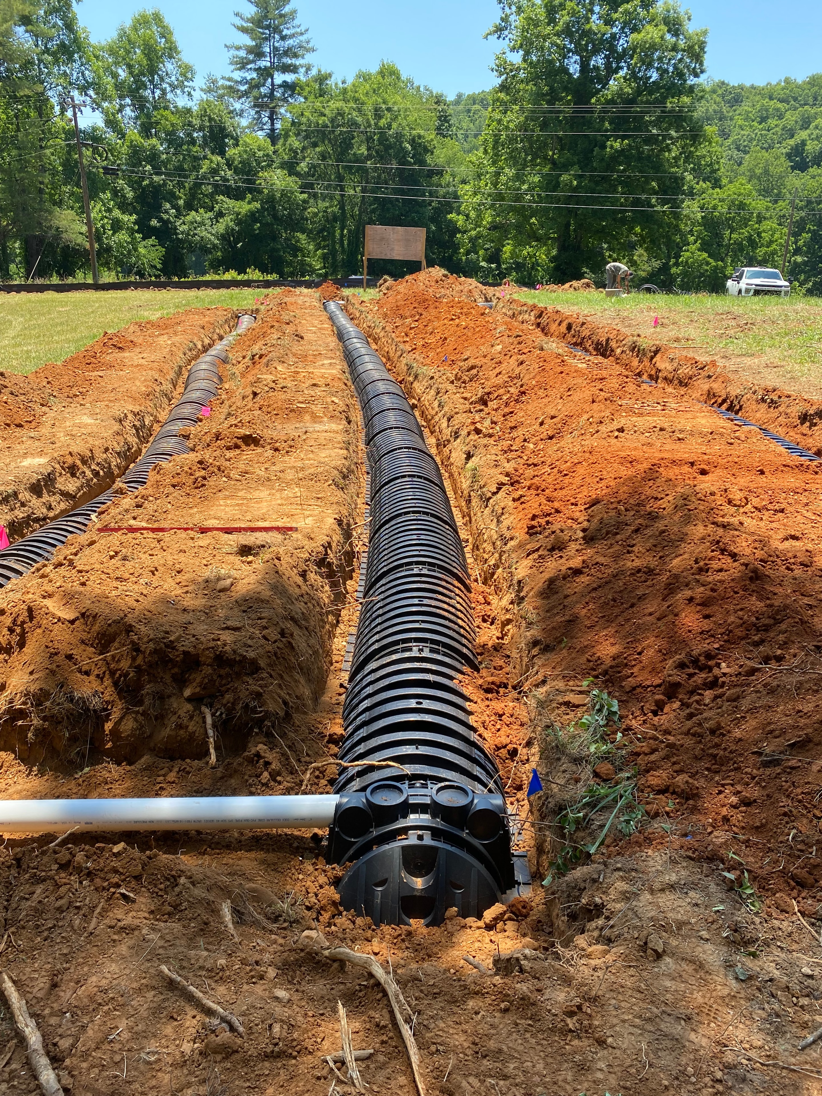 Drainage pipes laid in excavated trenches