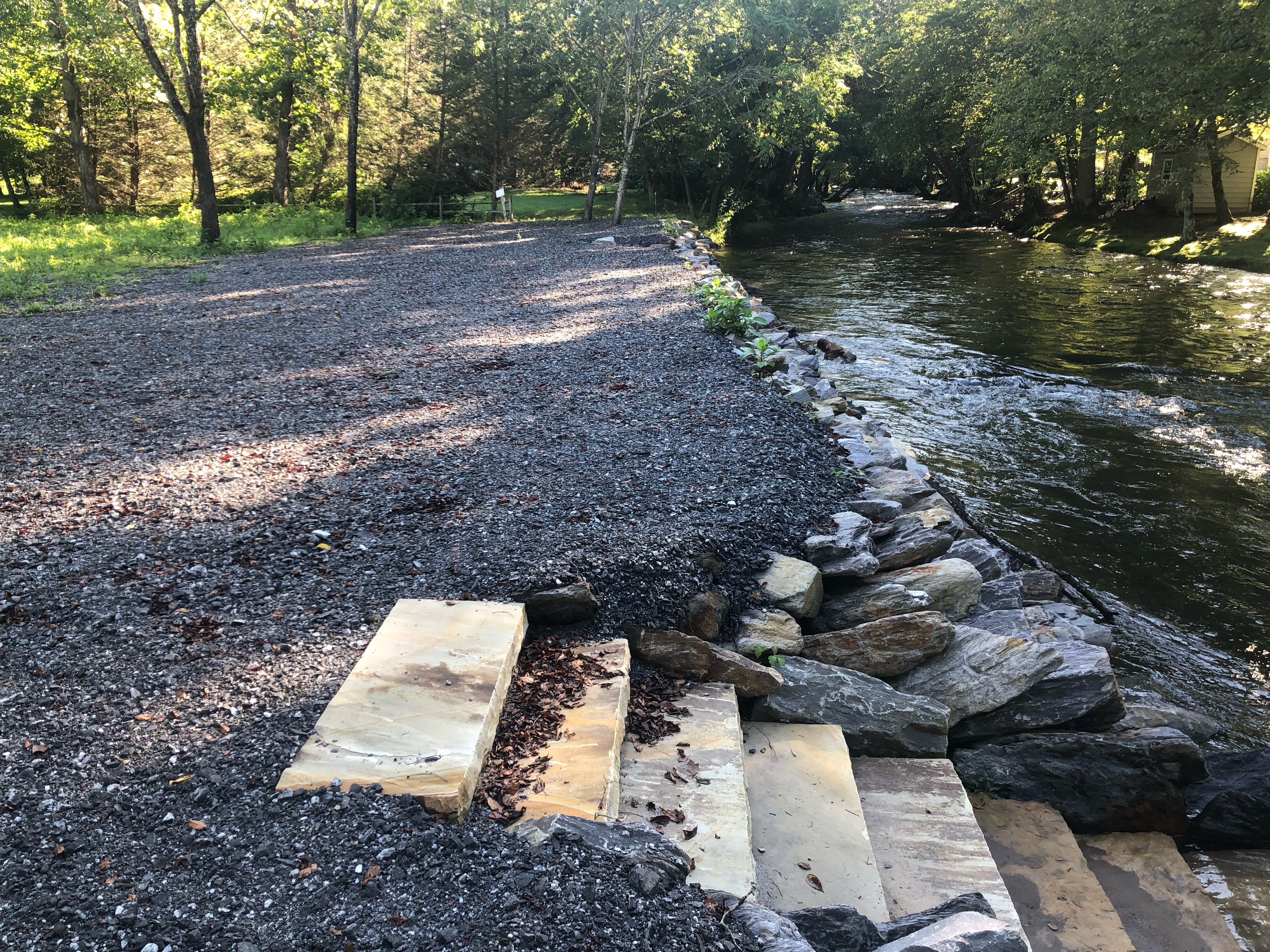 Gravel path with river stones in forest campground
