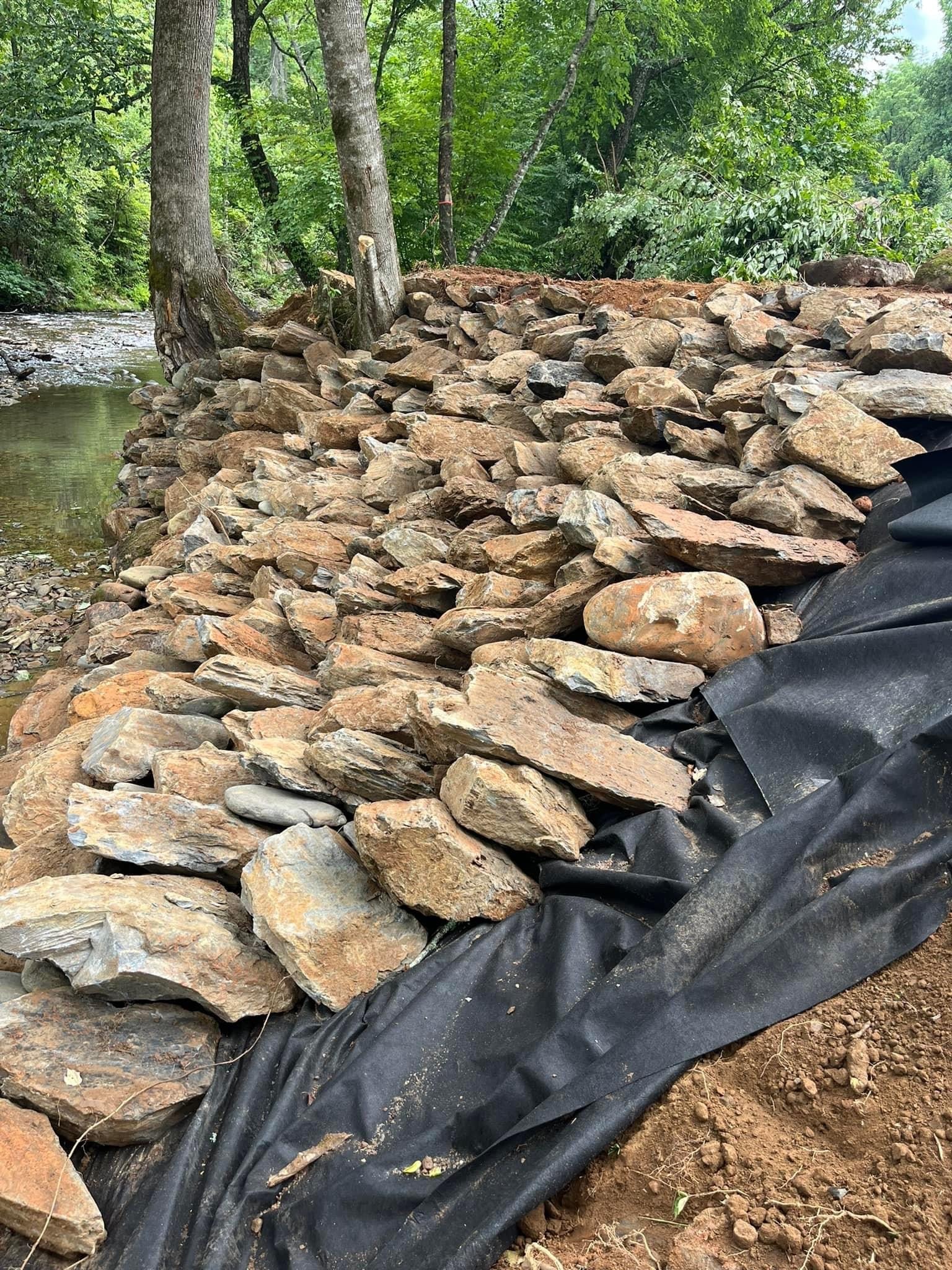 Rocky riverbank erosion control forest stream