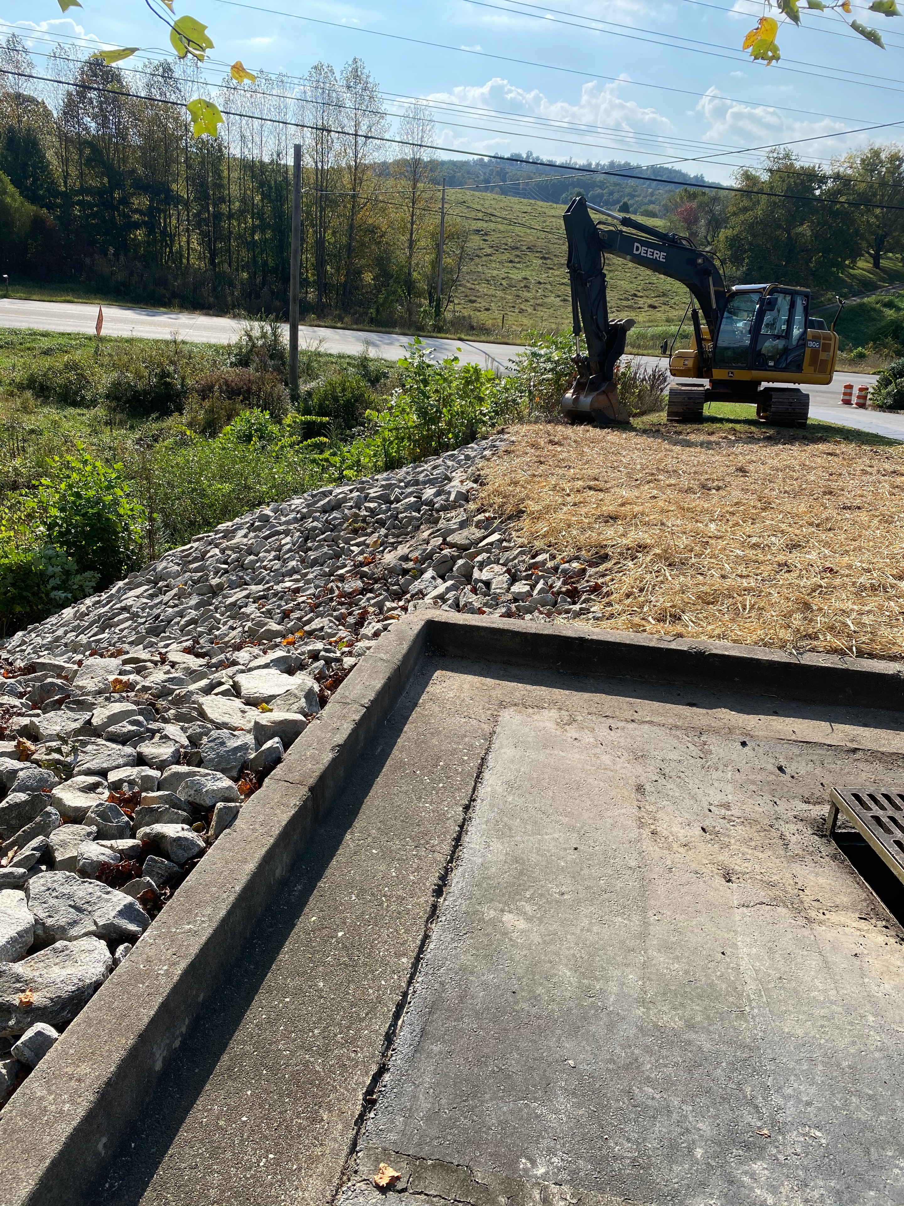 Excavator working on a rural construction site