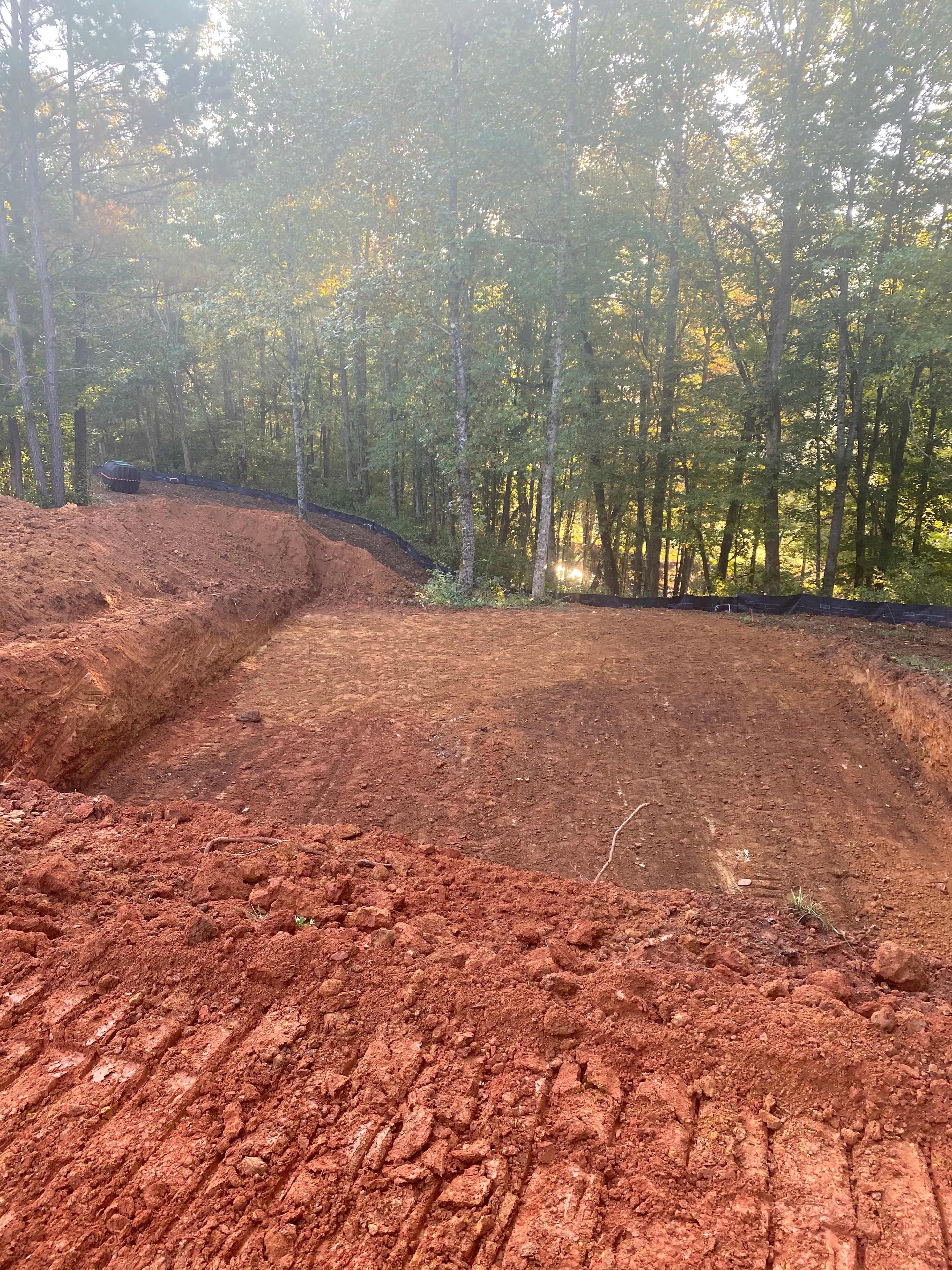 Dirt clearing in autumn forest
